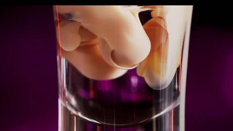 Bartender prepares a multi-layered cocktail macro Видео 159140082