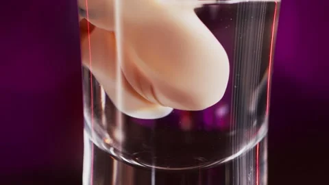 Bartender prepares a multi-layered cocktail macro Stockbeeldmateriaal 159140105