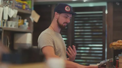 The bartender prepares the order and hit the check Video stock 68831532