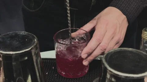 Bartender prepares vibrant alco beverage Stock Footage 294928151