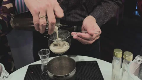 Bartender prepares vibrant alco beverage Stock Footage 294928202