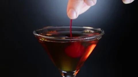 Bartender preparing alcoholic cocktail drink with cherry. Stock Footage 85226435