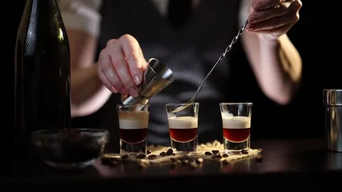 Bartender preparing B-52 cocktail Stock Footage 131324494