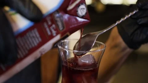 Bartender preparing a cocktail on a bar counter. Making wine in a crystal gla Stock Footage 147680295