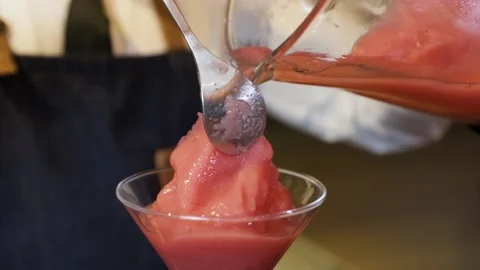 Bartender preparing a cocktail on a bar counter. Making daiquiri cocktail wit Stock Footage 147680319