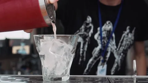 Bartender Preparing Cocktail on the Beach Stock Footage 137932923
