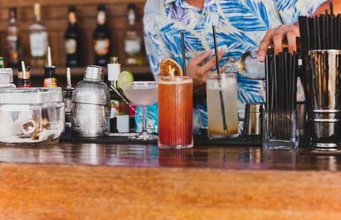 Bartender preparing a cocktail drink from for customer. Stock Photos