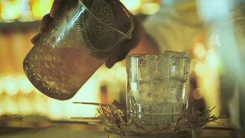 Bartender preparing cocktail drink with ice after shaking mixing and stirring Stock Footage 103849267
