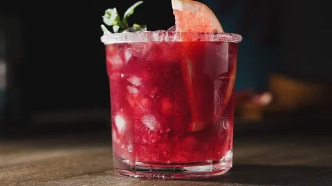 Bartender is preparing cocktail with grapefruit, mint and ice, slow motion. Stock Footage 123963912