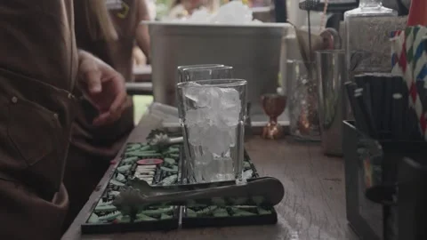 Bartender Preparing Cocktail with Ice and Fresh Mint Stock Footage 328594310