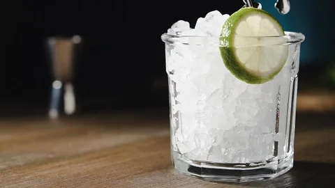 Bartender is preparing cocktail with lime, mint and ice. Stock Footage 124042036
