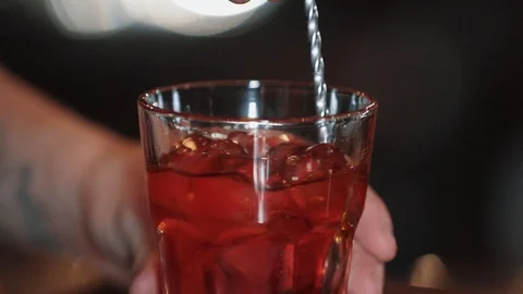 The bartender is preparing a cocktail at a modern bar. The bartenders mix the Video stock 125992991