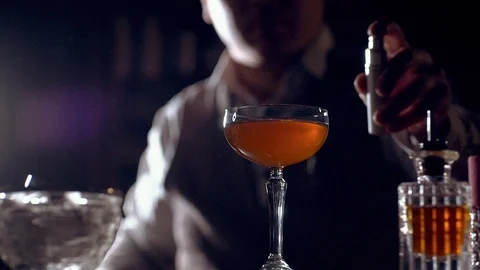 The bartender is preparing a cocktail "Rob Roy". Slow motion. Stock Footage 124241405