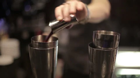 Bartender preparing a cocktail for the visitor. Close up Stock Footage 43763408