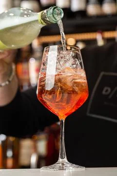 Bartender preparing on the counter Aperol Spritz, a classic refreshing Italia Stock Photos