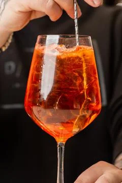 Bartender preparing on the counter Aperol Spritz, a classic refreshing Italia Stock Photos