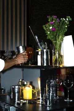 Bartender Preparing Drinks at Bar Counter Stock Photos