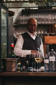 Bartender preparing drinks inside Figlmuller restaurant on Wollzeile in Vienn Stock Photos