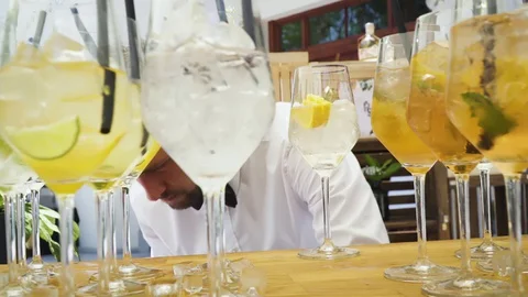 Bartender preparing, pouring refreshing alcohol drink with bubbles Stock Footage 128818555