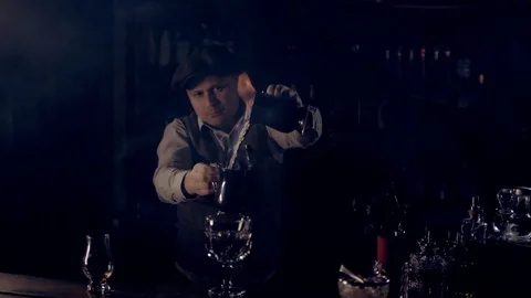 The bartender is preparing the punch "Blue Blazer". Stock Footage 124372552