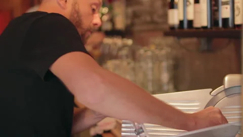 Bartender Preparing Traditional Charcuterie Board Behind Cozy Bar Counter Vidéo 344295643