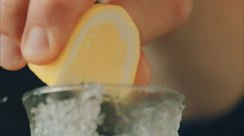 The bartender presses a lemon in a glass Stock Footage 52194018