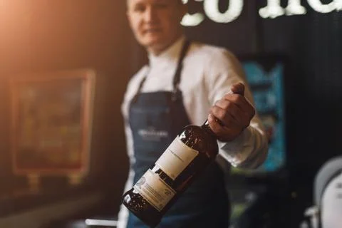 Bartender professionally working with om making drinks and cocktails Stock Photos