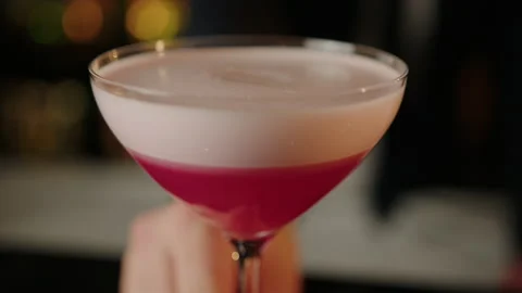 The bartender pushes a cocktail to the client in the bar Stock Footage 219113740