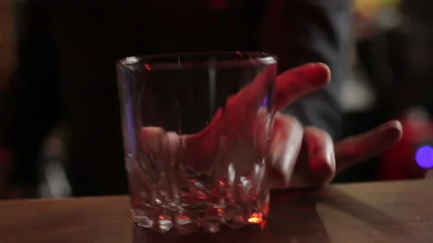 Bartender Puting Glass and Ice inside at a bar Stock Footage 141658535