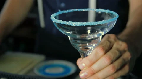 The bartender puts on the bar an empty glass with sugar rim Stock Footage 41776492
