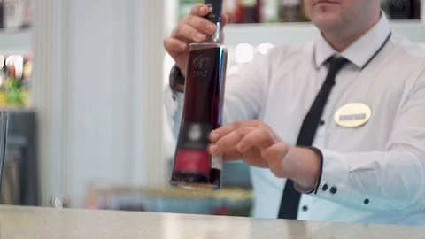 Bartender puts bottles on the bar Stock Footage 101968183
