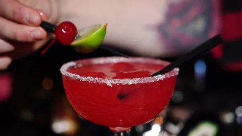 Bartender puts cherries in glass in interior bar. Stock Footage 149247949