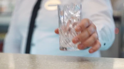 Bartender puts an empty glass on the bar Stock Footage 101968644