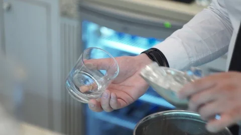 Bartender puts ice in the rocks Stock Footage 101968267