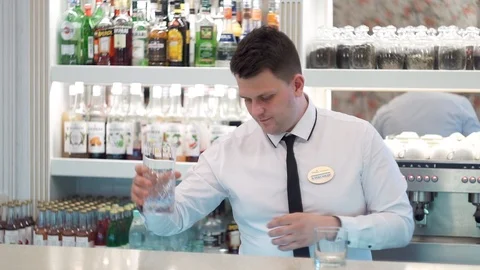Bartender puts ice in the rocks Stock Footage 101968419