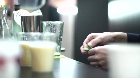 The bartender puts mint leaves in drinks at the bar Stock Footage 137028223