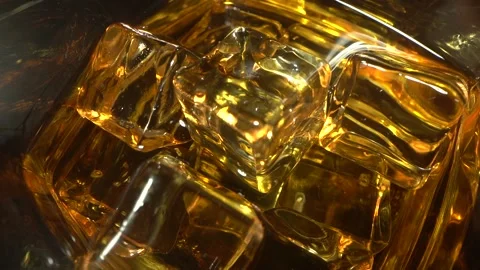 Bartender is putting professional crystal ice cubes in a glass while preparing Video stock 153912751