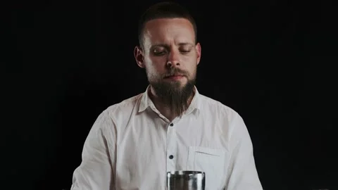 Bartender putting sugar powder in shaker while preparing alcoholic cocktail Stock Footage 132764372