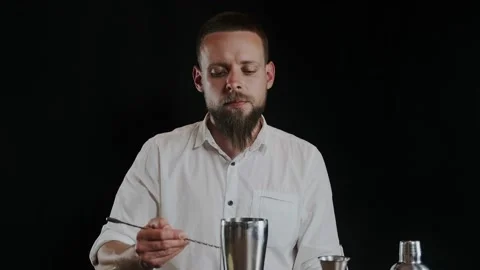 Bartender putting sugar powder in shaker while preparing alcoholic cocktail Stock Footage 133984872