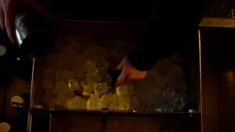 Bartender Scooping Ice for a Cocktail Preparation Stock Footage 262610291
