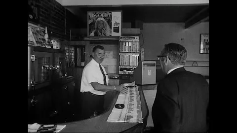 Bartender Serves Beer in Busy Australian Pub, 1960s Stock Footage 338271770