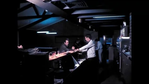 Bartender Serves Glass of Beer in Australian Pub, 1975 Stock Footage 339276549