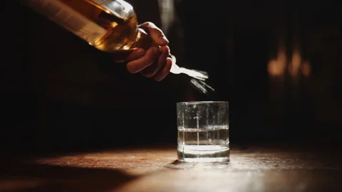 Bartender Serves a Pour of Liquor Stock Footage 88601583