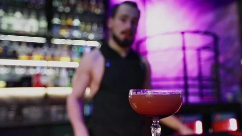 The bartender serves ready-made cocktail in the night bar. Stock Footage 103372276