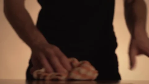 The bartender serves the visitor by pouring him whiskey Stock Footage 129262416