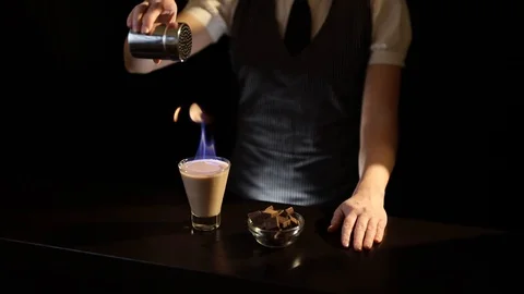 Bartender serving Baileys comet cocktail Stock Footage 128739065