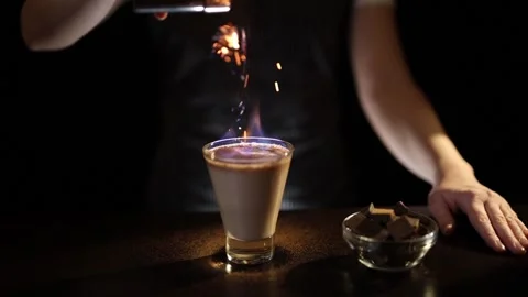 Bartender serving burning Irish cream cocktail Stock Footage 133433126