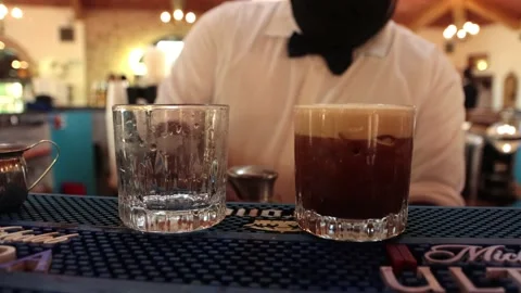 Bartender serving a carajillo coffee alchoholic drink in bar Stock Footage 155024508