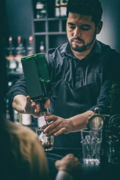 Bartender is serving cocktai Stock Photos