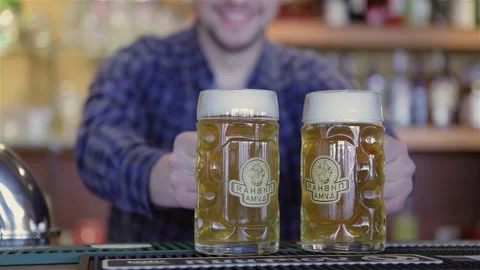 Bartender serving drinks at a lively party Видео 311826335